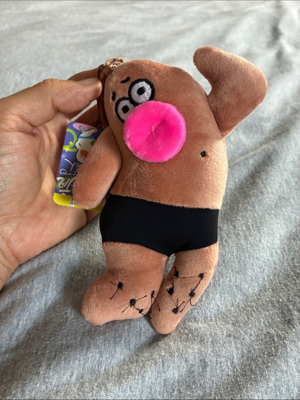 Cute Plush Keychain with Pink Nose and Black Shorts